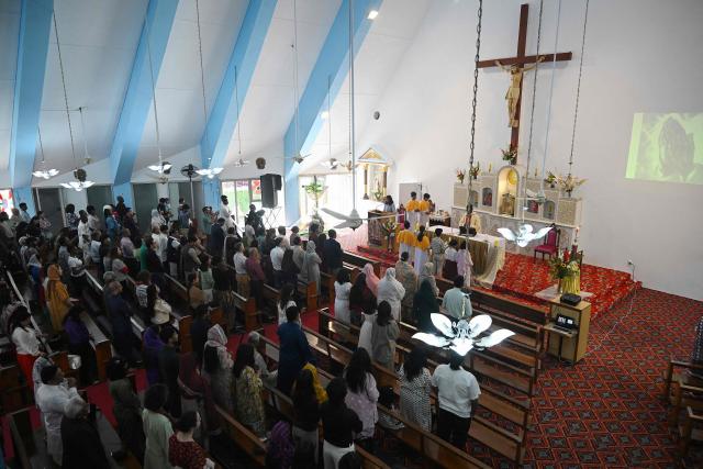 Christians attend Easter Sunday mass at the Fatima Church in Islamabad on April 5, 2026. (Photo by Aamir QURESHI / AFP)