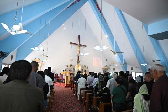 Christians attend Easter Sunday mass at the Fatima Church in Islamabad on April 5, 2026. (Photo by Aamir QURESHI / AFP)