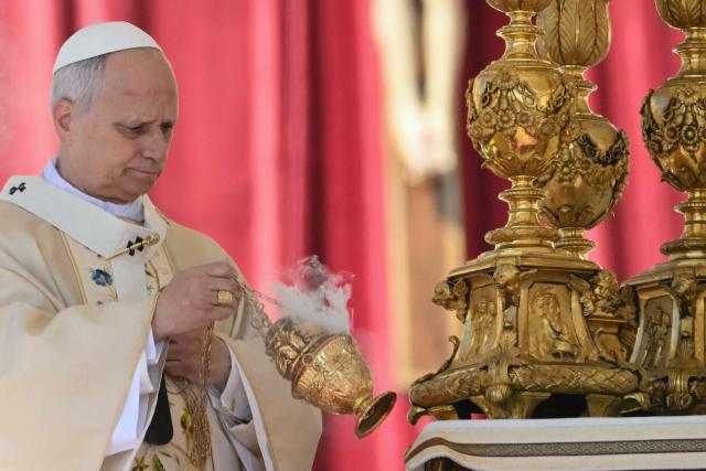 Pope Leo XIV presides over the Easter Mass as part of the Holy Week celebrations, at St Peter's square in the Vatican on April 5, 2026. (Photo by Alberto PIZZOLI / AFP)