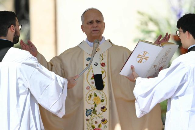 Pope Leo XIV presides over the Easter Mass as part of the Holy Week celebrations, at St Peter's square in the Vatican on April 5, 2026. (Photo by Alberto PIZZOLI / AFP)