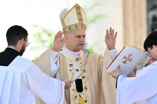 Pope Leo XIV presides over the Easter Mass as part of the Holy Week celebrations, at St Peter's square in the Vatican on April 5, 2026. (Photo by Alberto PIZZOLI / AFP)