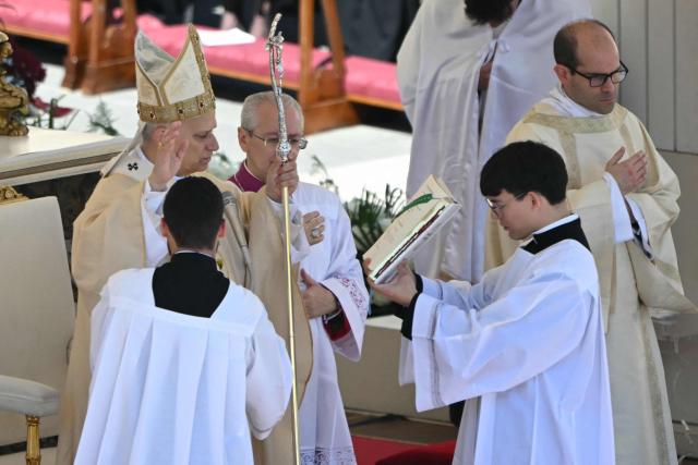 Pope Leo XIV presides over the Easter Mass as part of the Holy Week celebrations, at St Peter's square in the Vatican on April 5, 2026. (Photo by Andreas SOLARO / AFP)