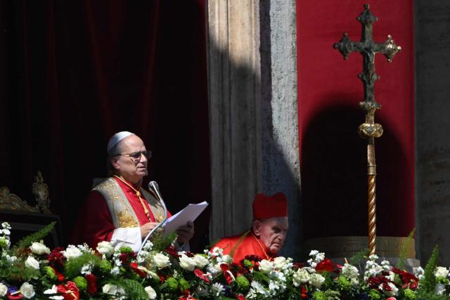 Pope Leo XIV addresses the crowd from the main balcony of St. Peter's basilica for the Urbi et Orbi message and blessing to the city and the world as part of Easter celebrations, at St Peter's square in the Vatican on April 5, 2025. (Photo by Andreas SOLARO / AFP)