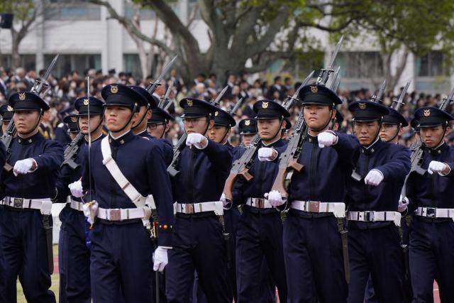 EDITORS NOTE: Graphic content / National Defense Academy students participate in a review parade as part of the National Defense Academy Entrance Ceremony in Yokosuka, Kanagawa Prefecture on April 5, 2026. (Photo by Kazuhiro NOGI / AFP)