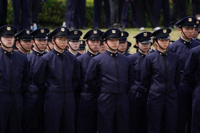 EDITORS NOTE: Graphic content / New students at the National Defense Academy participate in a review parade as part of the their entrance ceremony in Yokosuka, Kanagawa Prefecture on April 5, 2026. (Photo by Kazuhiro NOGI / AFP)