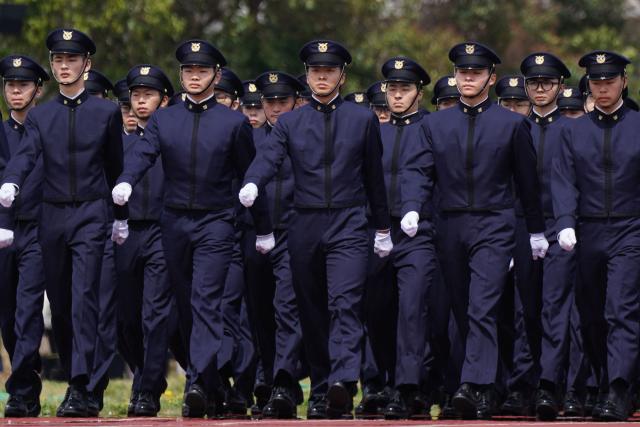EDITORS NOTE: Graphic content / New students at the National Defense Academy participate in a review parade as part of the their entrance ceremony in Yokosuka, Kanagawa Prefecture on April 5, 2026. (Photo by Kazuhiro NOGI / AFP)