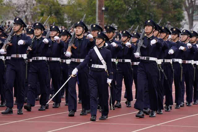 EDITORS NOTE: Graphic content / National Defense Academy students participate in a review parade as part of the National Defense Academy Entrance Ceremony in Yokosuka, Kanagawa Prefecture on April 5, 2026. (Photo by Kazuhiro NOGI / AFP)