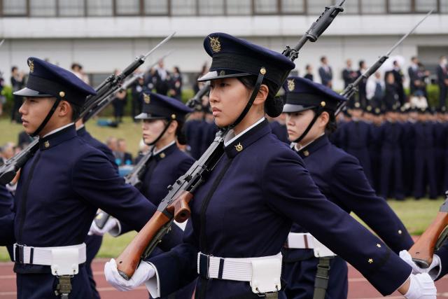 EDITORS NOTE: Graphic content / National Defense Academy students participate in a review parade as part of the National Defense Academy Entrance Ceremony in Yokosuka, Kanagawa Prefecture on April 5, 2026. (Photo by Kazuhiro NOGI / AFP)