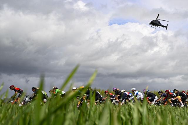 The pack of riders (peloton) cycles during the women's race of the 'Ronde van Vlaanderen/ Tour des Flandres/ Tour of Flanders' UCI WorldTour one day cycling race, 164,1 km with start and finish in Oudenaarde, on April 5, 2026. (Photo by JASPER JACOBS / Belga / AFP) / Belgium OUT