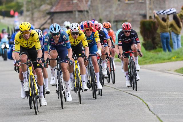 Team Visma-Lease a Bike's French rider Christophe Laporte (L), Soudal Quick-Step's Belgian rider Japser Stuyven and Team Visma-Lease a Bike's Belgian rider Wout van Aert (C) cycle in the men's race of the 'Ronde van Vlaanderen/ Tour des Flandres/ Tour of Flanders' UCI WorldTour one day cycling race, 278 km from Antwerp to Oudenaarde, in Haaltert on April 5, 2026. (Photo by DAVID PINTENS / Belga / AFP) / Belgium OUT
