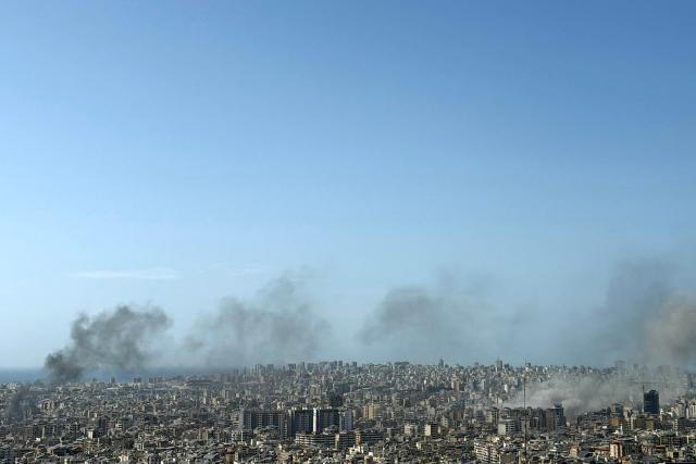 Smoke rises from the sites of Israeli strikes in Beirut's southern suburbs, on April 5, 2026. An Israeli strike hit south Beirut on April 5, Lebanese state media reported, with a medical source telling AFP it made impact about 100 metres away from a public hospital. The strike hit Beirut's Jnah neighbourhood near Rafik Hariri University Hospital, the largest public medical facility in the country. (Photo by ibrahim AMRO / AFP) / 