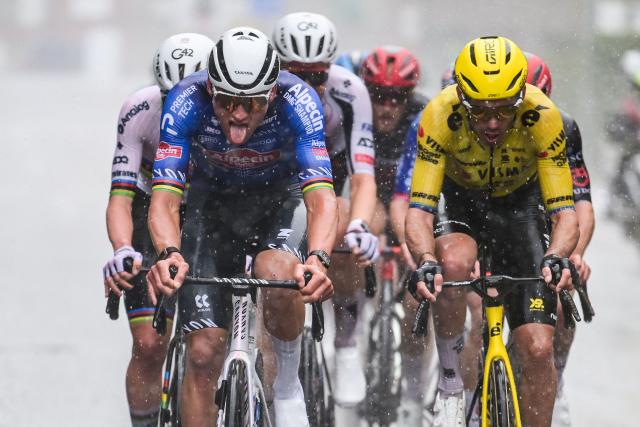 Alpecin-Premier Tech's Dutch rider Mathieu van der Poel (L) and Team Visma-Lease a Bike's French rider Christophe Laporte cycle in the men's race of the 'Ronde van Vlaanderen/ Tour des Flandres/ Tour of Flanders' UCI WorldTour one day cycling race, 278 km from Antwerp to Oudenaarde, in Haaltert on April 5, 2026. (Photo by DAVID PINTENS / Belga / AFP) / Belgium OUT