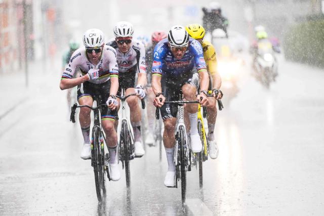 Alpecin-Premier Tech's Dutch rider Mathieu van der Poel (R) and UAE Team Emirates' Slovenian rider Tadej Pogacar cycle in the men's race of the 'Ronde van Vlaanderen/ Tour des Flandres/ Tour of Flanders' UCI WorldTour one day cycling race, 278 km from Antwerp to Oudenaarde, in Haaltert on April 5, 2026. (Photo by DAVID PINTENS / Belga / AFP) / Belgium OUT