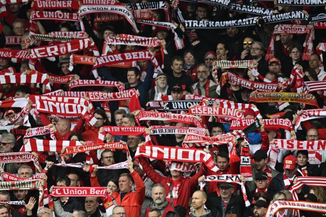 Fans of Union Berlin display their scarfs ahead the German first division Bundesliga football match between Union Berlin and St Pauli in Berlin on April 5, 2026. (Photo by John MACDOUGALL / AFP) / DFL REGULATIONS PROHIBIT ANY USE OF PHOTOGRAPHS AS IMAGE SEQUENCES AND/OR QUASI-VIDEO