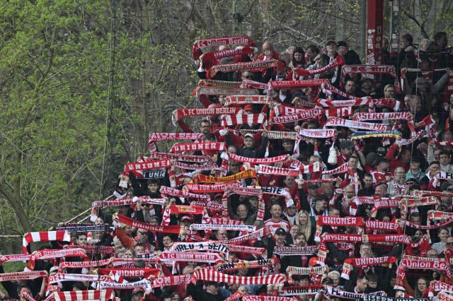 Fans of Union Berlin display their scarfs ahead the German first division Bundesliga football match between Union Berlin and St Pauli in Berlin on April 5, 2026. (Photo by John MACDOUGALL / AFP) / DFL REGULATIONS PROHIBIT ANY USE OF PHOTOGRAPHS AS IMAGE SEQUENCES AND/OR QUASI-VIDEO