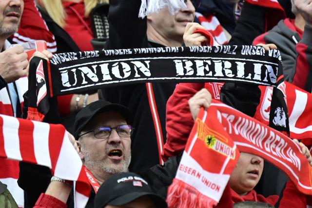 Fans of Union Berlin display their scarfs ahead the German first division Bundesliga football match between Union Berlin and St Pauli in Berlin on April 5, 2026. (Photo by John MACDOUGALL / AFP) / DFL REGULATIONS PROHIBIT ANY USE OF PHOTOGRAPHS AS IMAGE SEQUENCES AND/OR QUASI-VIDEO