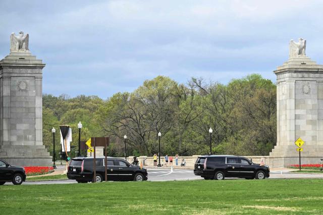The motorcade carrying US President Donald Trump drives around Memorial Circle near the entrance of Arlington National Cemetery on April 5, 2026, in Arlington, Virginia. President Trump has previously proposed building an enormous, 250-foot tall "Independence Arch" -- reminiscent of Paris' Arc de Triomphe -- near the Memorial Circle site along the Potomac River near the entrance to Arlington National Cemetery. (Photo by Mandel NGAN / AFP)