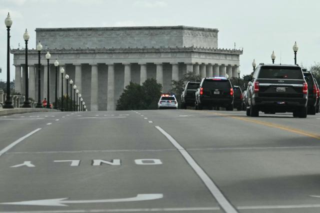 The motorcade carrying US President Donald Trump drives across Memorial Bridge toward the Lincoln Memorial while crossing from Arlington, Virginia, into Washington, DC, after driving around Memorial Circle near the entrance of Arlington National Cemetery on April 5, 2026. President Trump has previously proposed building an enormous, 250-foot tall "Independence Arch" -- reminiscent of Paris' Arc de Triomphe -- near the Memorial Circle site along the Potomac River near the entrance to Arlington National Cemetery. (Photo by Mandel NGAN / AFP)