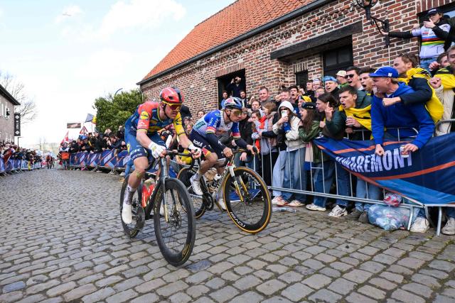 Lidl-Trek's Danish rider Mads Pedersen and Red Bull-BORA-hansgrohe's Belgian rider Remco Evenepoel cycle in the men's race of the 'Ronde van Vlaanderen/ Tour des Flandres/ Tour of Flanders' UCI WorldTour one day cycling race, 278 km from Antwerp to Oudenaarde, in Haaltert on April 5, 2026. (Photo by DAVID PINTENS / Belga / AFP) / Belgium OUT
