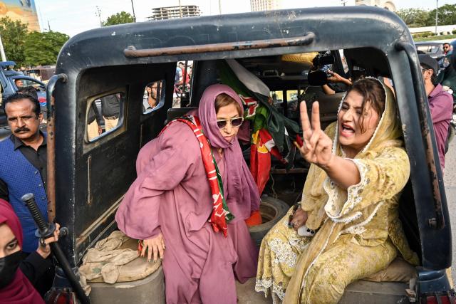 Police personnel detain supporters of Pakistan’s opposition Pakistan Tehreek-e-Insaf (PTI) party as they protest against a fuel price hike in Karachi on April 5, 2026. Pakistan drastically raised fuel prices in response to spiking global prices caused by the Iran war, the country's petroleum minister said. (Photo by Asif HASSAN / AFP)