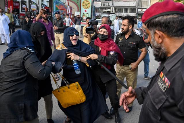 Police personnel detain supporters of Pakistan’s opposition Pakistan Tehreek-e-Insaf (PTI) party as they protest against a fuel price hike in Karachi on April 5, 2026. Pakistan drastically raised fuel prices in response to spiking global prices caused by the Iran war, the country's petroleum minister said. (Photo by Asif HASSAN / AFP)