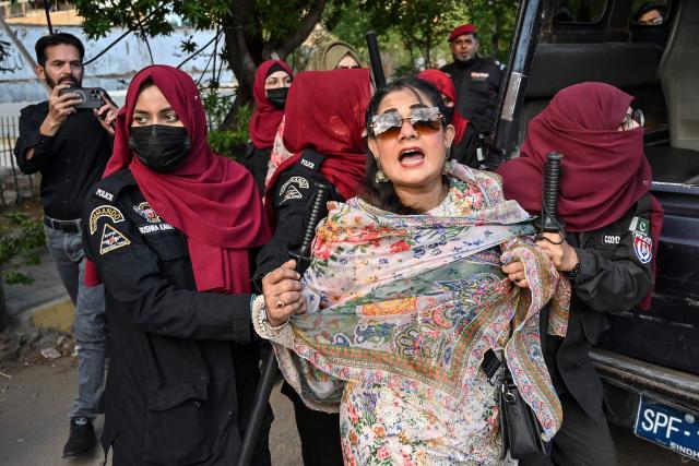 Police personnel detain supporters of Pakistan’s opposition Pakistan Tehreek-e-Insaf (PTI) party as they protest against a fuel price hike in Karachi on April 5, 2026. Pakistan drastically raised fuel prices in response to spiking global prices caused by the Iran war, the country's petroleum minister said. (Photo by Asif HASSAN / AFP)