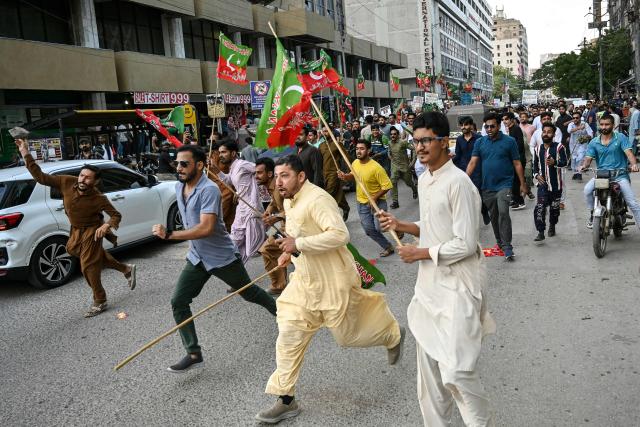 Supporters of Pakistan’s opposition Pakistan Tehreek-e-Insaf (PTI) party clash with police as they protest against a hike in fuel prices in Karachi on April 5, 2026. Pakistan drastically raised fuel prices in response to spiking global prices caused by the Iran war, the country's petroleum minister said. (Photo by Asif HASSAN / AFP)