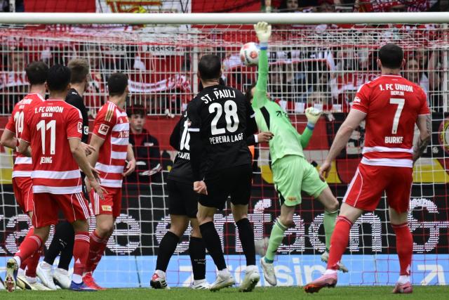 St Pauli's Portuguese forward #28 Mathias Pereira Lage (C) scores the opening goal during the German first division Bundesliga football match between Union Berlin and St Pauli in Berlin on April 5, 2026. (Photo by John MACDOUGALL / AFP) / DFL REGULATIONS PROHIBIT ANY USE OF PHOTOGRAPHS AS IMAGE SEQUENCES AND/OR QUASI-VIDEO