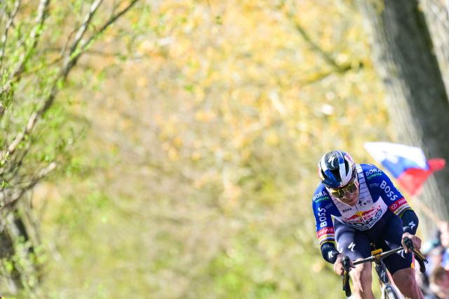 Red Bull-BORA-hansgrohe's Belgian rider Remco Evenepoel cycles in the men's race of the 'Ronde van Vlaanderen/ Tour des Flandres/ Tour of Flanders' UCI WorldTour one day cycling race, 278 km from Antwerp to Oudenaarde, in Haaltert on April 5, 2026. (Photo by DAVID PINTENS / Belga / AFP) / Belgium OUT