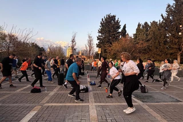 People exercise at the Pardisan Park in Tehran on April 5, 2026. The war, which erupted on February 28, 2026 with US-Israeli strikes on Iran, has engulfed the Middle East and convulsed the global economy. (Photo by ATTA KENARE / AFP)
