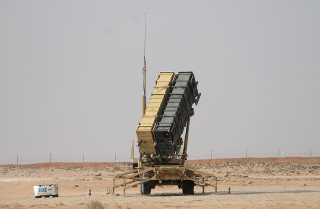 (FILES) A Patriot missile battery is seen near Prince Sultan air base at Al-Kharj on February 20, 2020. For generations, a Saudi oasis town has been a favoured spot for stressed visitors from nearby Riyadh to come and decompress. But the serenity in Saudi Arabia's Al Kharj has been rattled after finding itself in the line of fire from Iranian attacks. Renowned for its dates and palm lined streets, the town also lies on the edge of the sprawling Prince Sultan Air Base. (Photo by Andrew CABALLERO-REYNOLDS / POOL / AFP)