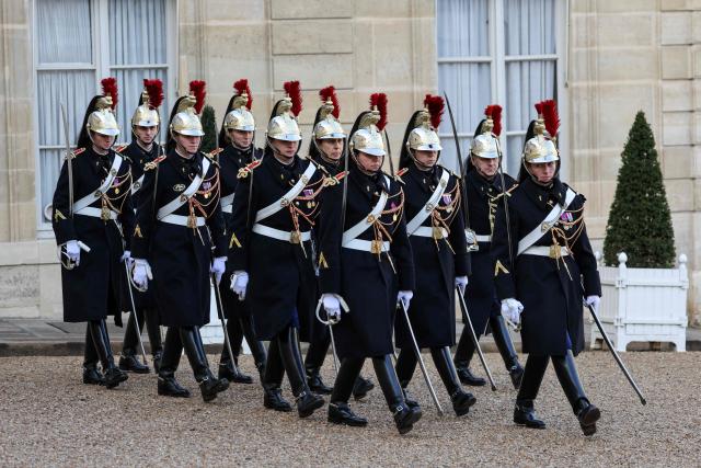 (FILES) French Republican Guards prepare before diplomatic meetings at the Elysee presidential Palace in Paris on January 30, 2026. An investigation is underway in Paris following a complaint filed by a gendarme who denounces ‘racist harassment’ within the prestigious Republican Guard. The 29-year-old serviceman filed his complaint on December 17, 2025, and was then interviewed on January 21, 2026, according to a source close to the case. (Photo by Ludovic MARIN / AFP)