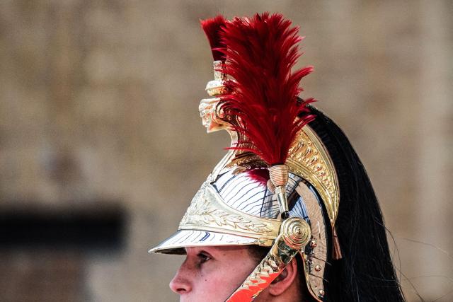 (FILES) French Republican Guard stand to welcome participants during the International Conference on Syria at the Ministerial Conference Center, in Paris on February 13, 2025. An investigation is underway in Paris following a complaint filed by a gendarme who denounces ‘racist harassment’ within the prestigious Republican Guard. The 29-year-old serviceman filed his complaint on December 17, 2025, and was then interviewed on January 21, 2026, according to a source close to the case. (Photo by Sameer Al-DOUMY / AFP)