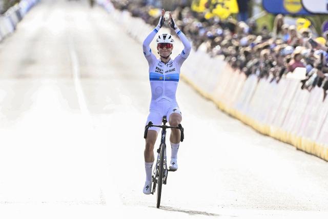 FDJ United-Suez's Dutch rider Demi Vollering celebrates winning the women's race of the 'Ronde van Vlaanderen/ Tour des Flandres/ Tour of Flanders' UCI WorldTour one day cycling race, 164,1 km with start and finish in Oudenaarde, on April 5, 2026. (Photo by ERIC LALMAND / Belga / AFP) / Belgium OUT