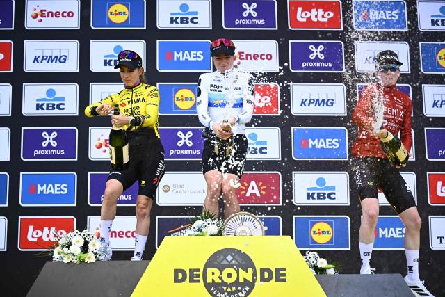 FDJ United-Suez's Dutch rider Demi Vollering (C) celebrates her victory flanked by second-placed Team Visma-Lease a Bike's French rider Pauline Ferrand Prevot (L) and third-placed Fenix-Premier Tech's Dutch rider Puck Pieterse after the women's race of the 'Ronde van Vlaanderen/ Tour des Flandres/ Tour of Flanders' UCI WorldTour one day cycling race, 164,1 km with start and finish in Oudenaarde, on April 5, 2026. (Photo by JASPER JACOBS / Belga / AFP) / Belgium OUT