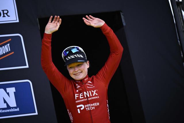 Third-placed Fenix-Premier Tech's Dutch rider Puck Pieterse reatcs on the podium after the women's race of the 'Ronde van Vlaanderen/ Tour des Flandres/ Tour of Flanders' UCI WorldTour one day cycling race, 164,1 km with start and finish in Oudenaarde, on April 5, 2026. (Photo by JASPER JACOBS / Belga / AFP) / Belgium OUT