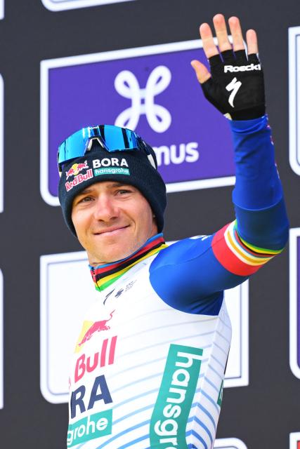 Third-placed Red Bull-BORA-hansgroh's Belgian rider Remco Evenepoel react on the podium after the men's race of the 'Ronde van Vlaanderen/ Tour des Flandres/ Tour of Flanders' UCI WorldTour one day cycling race, 278 km from Antwerp to Oudenaarde, in Haaltert on April 5, 2026. (Photo by DAVID PINTENS / Belga / AFP) / Belgium OUT