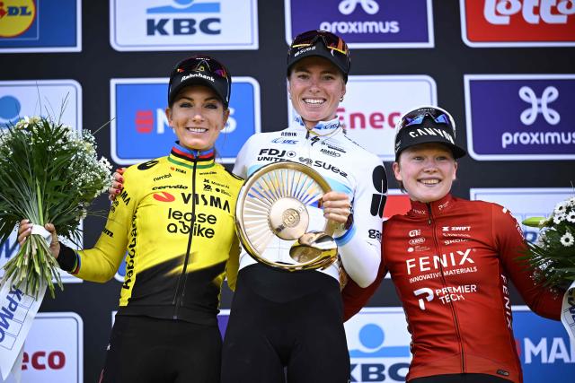 FDJ United-Suez's Dutch rider Demi Vollering (C) celebrates her victory flanked by second-placed Team Visma-Lease a Bike's French rider Pauline Ferrand Prevot (L) and third-placed Fenix-Premier Tech's Dutch rider Puck Pieterse after the women's race of the 'Ronde van Vlaanderen/ Tour des Flandres/ Tour of Flanders' UCI WorldTour one day cycling race, 164,1 km with start and finish in Oudenaarde, on April 5, 2026. (Photo by JASPER JACOBS / Belga / AFP) / Belgium OUT
