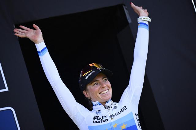 FDJ United-Suez's Dutch rider Demi Vollering celebrates her victory on the podium after the women's race of the 'Ronde van Vlaanderen/ Tour des Flandres/ Tour of Flanders' UCI WorldTour one day cycling race, 164,1 km with start and finish in Oudenaarde, on April 5, 2026. (Photo by JASPER JACOBS / Belga / AFP) / Belgium OUT