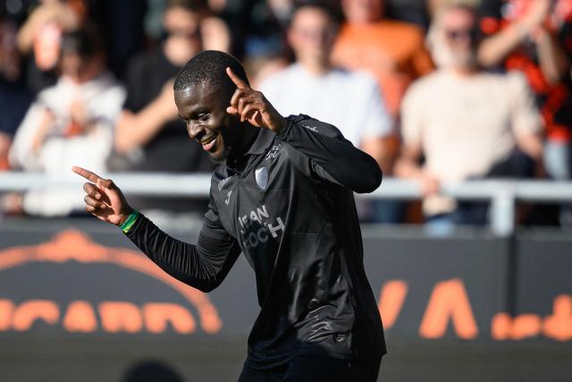 Lorient's Senegalese forward #12 Bamba Dieng celebrates after scoring his team's first goal during the French L1 football match between FC Lorient and Paris FC  at the Stade du Moustoir in Lorient, western France on April 5, 2026. (Photo by Loic VENANCE / AFP)