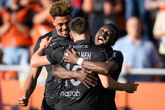 Lorient's players celebrate after scoring their team's first goal during the French L1 football match between FC Lorient and Paris FC  at the Stade du Moustoir in Lorient, western France on April 5, 2026. (Photo by Loic VENANCE / AFP)