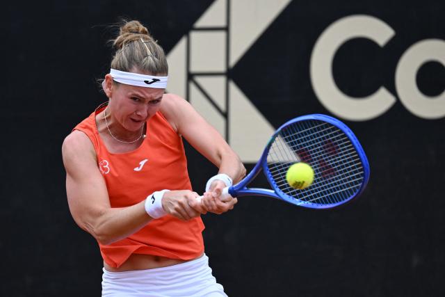 Czech Republic's Marie Bouzkova returns the ball to Hungary's Panna Udvardy during the WTA Bogota women's singles final match at the Country Club in Bogota on April 5, 2026. (Photo by RAUL ARBOLEDA / AFP)
