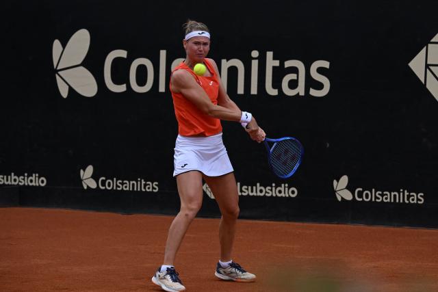 Czech Republic's Marie Bouzkova returns the ball to Hungary's Panna Udvardy during the WTA Bogota women's singles final match at the Country Club in Bogota on April 5, 2026. (Photo by RAUL ARBOLEDA / AFP)