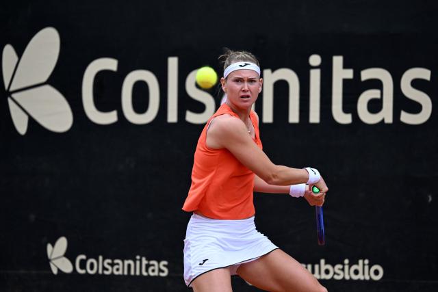 Czech Republic's Marie Bouzkova returns the ball to Hungary's Panna Udvardy during the WTA Bogota women's singles final match at the Country Club in Bogota on April 5, 2026. (Photo by RAUL ARBOLEDA / AFP)