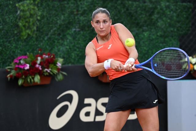 Hungary's Panna Udvardy returns the ball to Czech Republic's Marie Bouzkova during the WTA Bogota women's singles final match at the Country Club in Bogota on April 5, 2026. (Photo by RAUL ARBOLEDA / AFP)