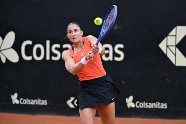 Hungary's Panna Udvardy returns the ball to Czech Republic's Marie Bouzkova during the WTA Bogota women's singles final match at the Country Club in Bogota on April 5, 2026. (Photo by RAUL ARBOLEDA / AFP)