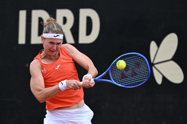Czech Republic's Marie Bouzkova returns the ball to Hungary's Panna Udvardy during the WTA Bogota women's singles final match at the Country Club in Bogota on April 5, 2026. (Photo by RAUL ARBOLEDA / AFP)