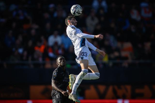 Paris FC's French midfielder #33 Pierre Lees-Melou (R) fights for the ball with Lorient's Cameroonian midfielder #62 Arthur Avom Ebong during the French L1 football match between FC Lorient and Paris FC  at the Stade du Moustoir in Lorient, western France on April 5, 2026. (Photo by Loic VENANCE / AFP)