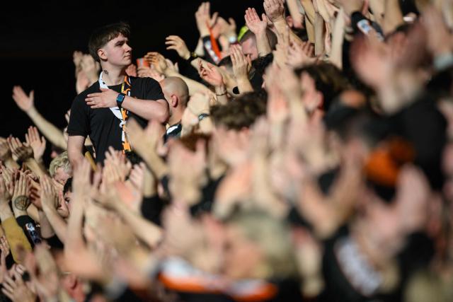 Lorient's supporters cheer on their team during the French L1 football match between FC Lorient and Paris FC  at the Stade du Moustoir in Lorient, western France on April 5, 2026. (Photo by Loic VENANCE / AFP)