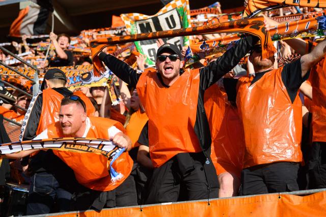 Lorient's supporters cheer on their team during the French L1 football match between FC Lorient and Paris FC  at the Stade du Moustoir in Lorient, western France on April 5, 2026. (Photo by Loic VENANCE / AFP)
